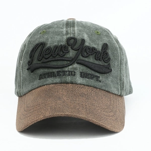 Detail of New York 3D embroidery on olive green and brown vintage baseball cap