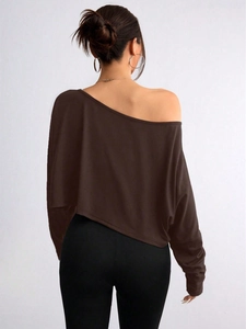 Back view of a woman wearing a dark brown off-shoulder long sleeve top on white background