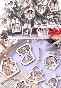Close-up of laser-cut double-layer wooden Christmas tree ornaments with reindeer and snowflake
