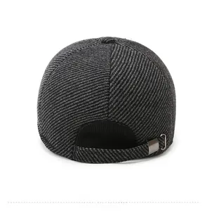 Detail view of winter baseball cap back with metal adjustment buckle and thick grey wool fabric