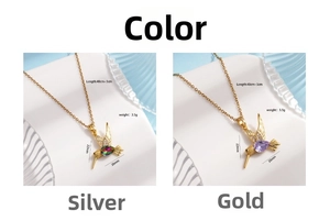 Macro detail of bird pendant necklace with colorful micro-inlaid cubic zirconia crystals