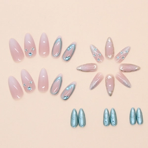 Detailed close-up of 24pcs blue and pink press-on nails with 3D rhinestones and metallic trim