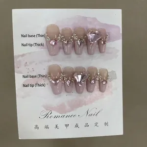 Handgemaakte roze gradiënt nepnagels met hartvormige edelstenen en strassteentjes