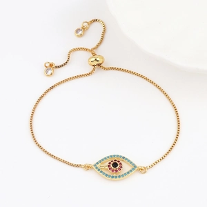 Macro view of adjustable evil eye bracelet with colorful zircons and sliding gold box chain