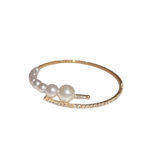 Elegant gold open bangle featuring gradient white pearls and sparkling pavé crystals