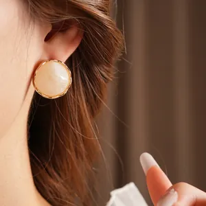 French vintage style round textured earrings with cream marble stone and gold wave rim
