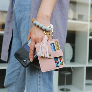 Pink PU leather card holder with white tassel and grey silicone bead wristlet keychain