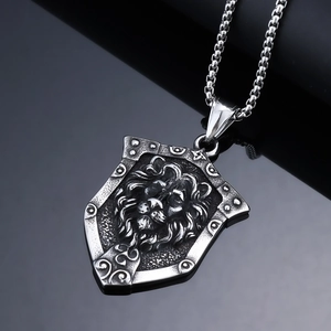 Detailed close-up of a silver punk lion head shield pendant on a stainless steel chain