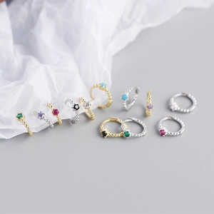 Detail of beaded S925 silver huggie earrings with colorful round zircon stone settings