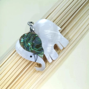 Detailed view of elephant shell pendant crafted from white mother-of-pearl and abalone