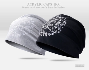 Detailed view of gray and black acrylic knitted caps featuring 'ROCK' music pattern