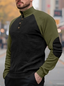 Detail view of olive green and black ribbed knit long sleeve shirt with retro buttons