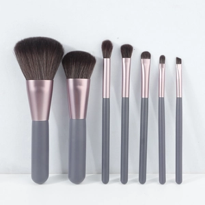 Detail of 7-piece makeup brush set featuring rose gold ferrules and soft synthetic bristles