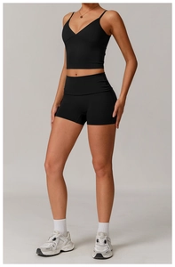 Close-up of black V-neck sports bra and high-waist shorts set for women's fitness