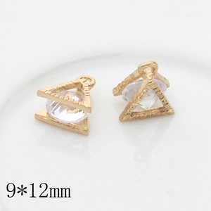 Macro shot of 9x12mm gold heart pendants with cubic zirconia for DIY jewelry