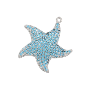Detailed view of silver star pendant with micro-pave turquoise stones for jewelry making