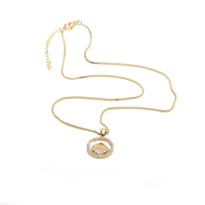 Elegant gold-tone box chain necklace with a zircon-studded shell pendant on white backdrop