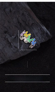 Detail shot of colorful enamel rabbit heads on a silver-plated open ring for women