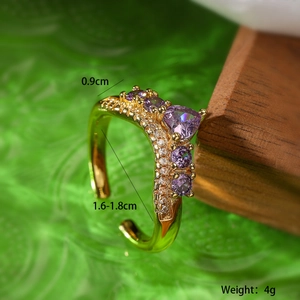Macro detail of gold wave ring with purple heart zircon and size dimensions shown