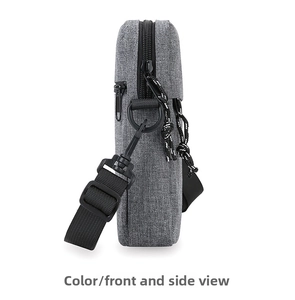 Side view of gray crossbody bag showing fabric texture, metal zipper and D-ring hook