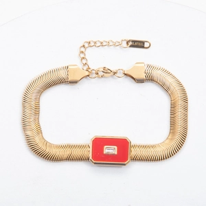 Detailed macro view of 18k gold plated stainless steel bracelet with red stone and zircon