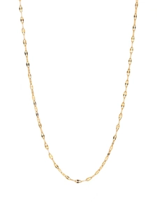 Detailed close-up of a gold-plated snake bone blade chain necklace for layered styling