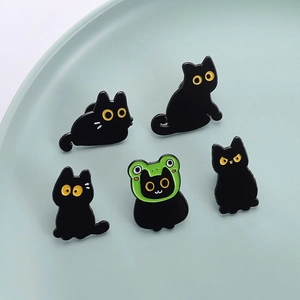 Set of 5 cute black cat enamel pins featuring various poses and a green frog hat
