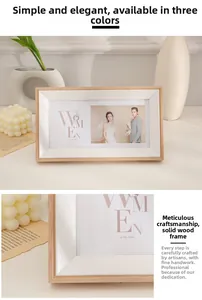 Detailed close-up showing light wood texture and white bevelled mat of a modern photo frame