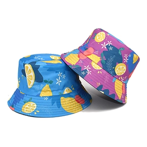 Blue and purple reversible bucket hats with vibrant lemon and floral prints for sun protection