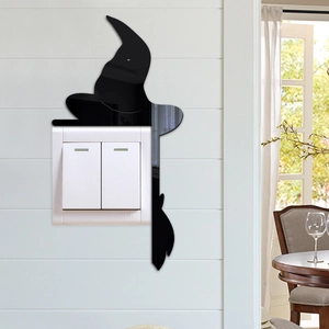 Detail showing a black 3D acrylic witch silhouette wall sticker around a light switch