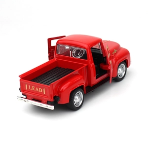 Detailed view of a vintage red pickup model with open door and golden LEAD text on tailgate