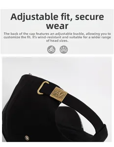 Close-up of adjustable bronze metal buckle on a black embroidered baseball cap