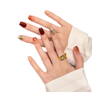 Handmade autumn caramel tone press-on nails set with red and gold glitter accents