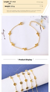 Detailed view of 17+4.5cm gold snake and butterfly charms on dainty link chains