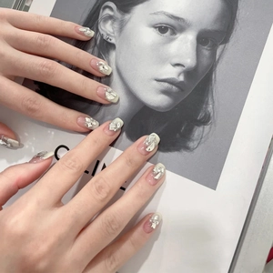 Handmade short French press-on nails with shimmering crystals and elegant pearls