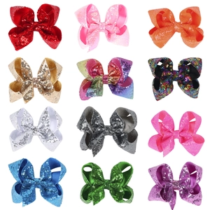 Set of 12 colorful 5-inch sequin bow hair clips for girls in various vibrant solid shades