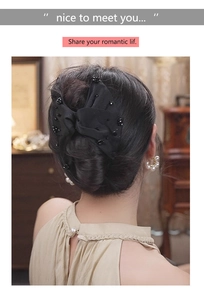 Close-up of a double-layered black satin bow hair claw clip with delicate bead accents