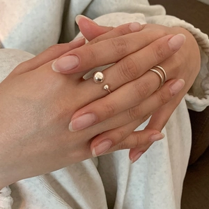 Close-up of S925 sterling silver minimalist geometric rings worn on model hand