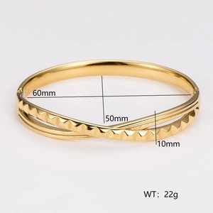 Macro view of gold knotted twist bangle showing 60mm by 50mm inner dimensions and 10mm width
