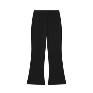 Detail view of high-waist black flare trousers with elegant drape and flared hemline