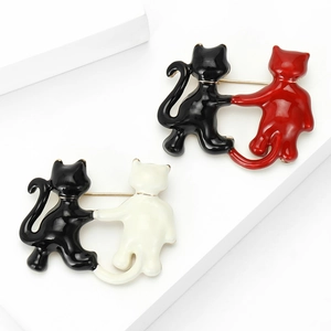 Cute cartoon enamel cat couple brooches in black, white, and red for fashion clothing accessories