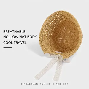 Breathable hollow knit sun hat with white lace ribbons in ginger yellow for women