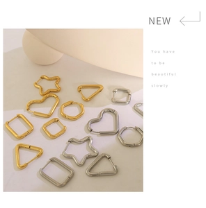 Collection of minimalist gold and silver geometric hoop earrings in various shapes