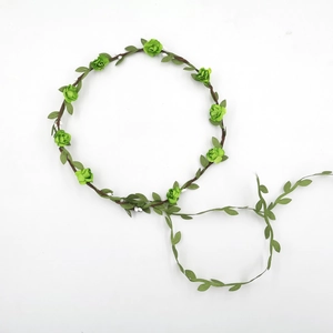 Floral bridal headpiece with green roses and foliage on natural brown vine