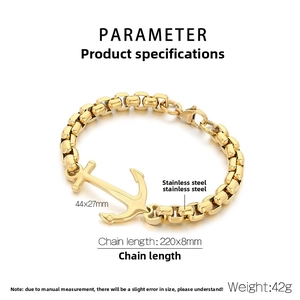 Detailed macro view of gold-plated stainless steel anchor pendant and square link chain