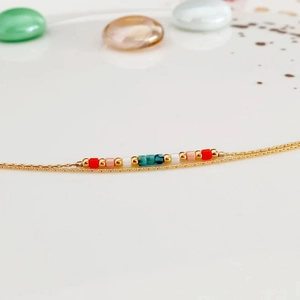Handmade woven seed bead bracelet with elegant gold chain for women in summer style