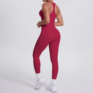 Detail view of burgundy yoga set featuring racerback tank and high waist side pocket leggings