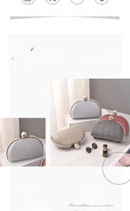 Detail of semi-circular glitter clutch with pearl edge trim and spherical metal clasp