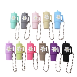 Miniature cup keychains with white daisy motifs in eleven assorted vibrant colors