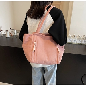 Borsa tote in velluto a coste rosa con tasche laterali e dettaglio corda intrecciata